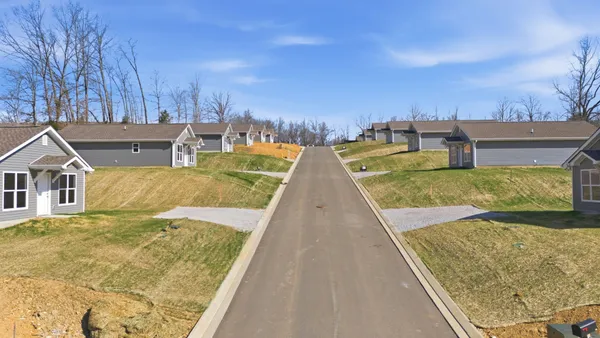 a view of a swimming pool with a yard