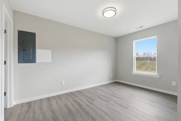 a bathroom with a sink a toilet and a large mirror