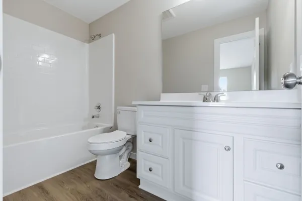 a aerial view of a house with outdoor space and lake view