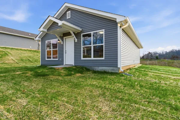 a view of swimming pool with a lounge chairs