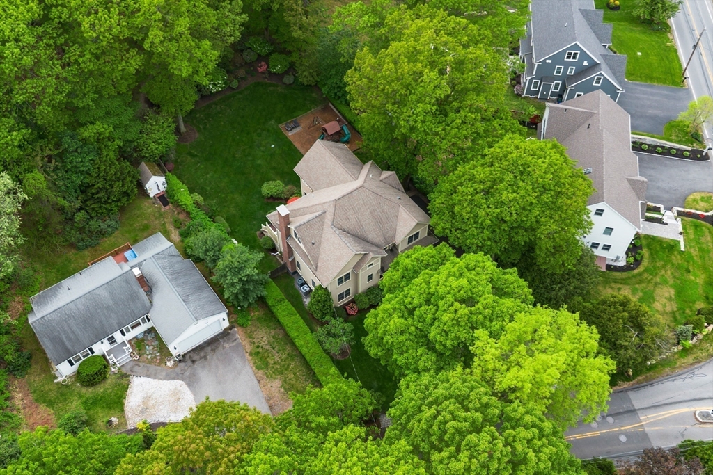 5 Walnut Street Lexington, MA 02421 - Photo 27 of 34 an aerial view of a house with yard and outdoor seating