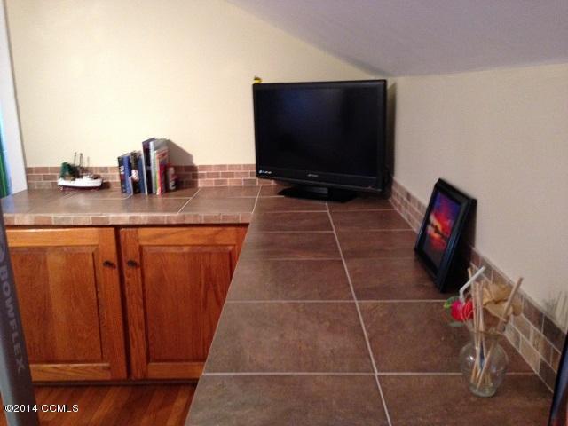 105 Channel Rock Road Beaufort, NC 28516 - Photo 56 of 103 Den cabinets with tiled counter tops