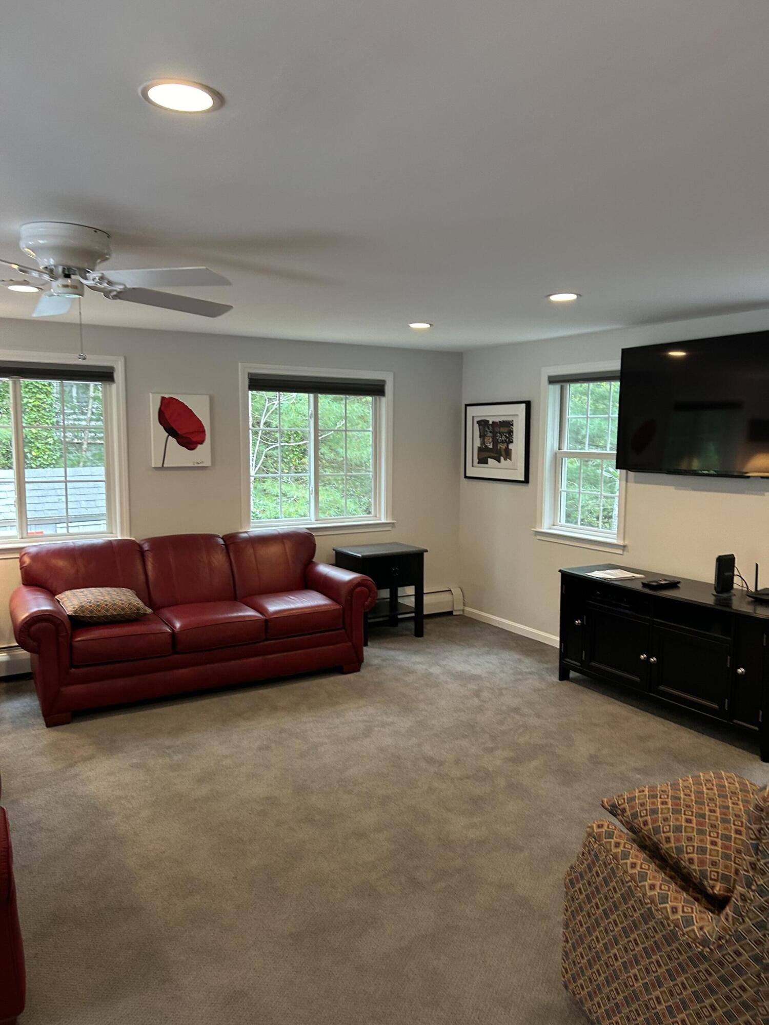 8 Bridgets Path Centerville, MA 02632 - Photo 11 of 43 a living room with furniture and a flat screen tv