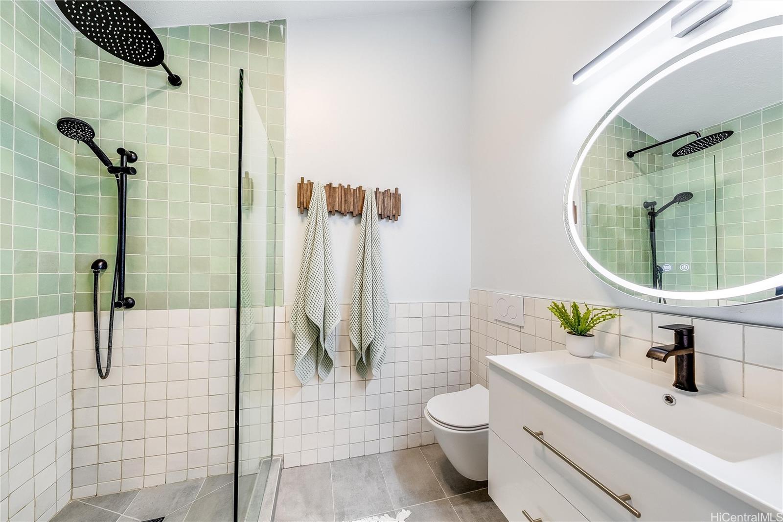 817 Ekoa Place Honolulu, HI 96821 - Photo 14 of 25 a bathroom with a sink a toilet and shower