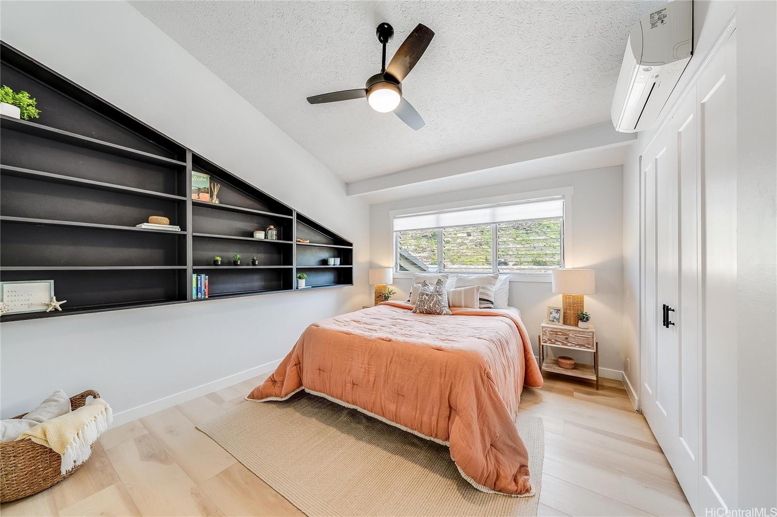 817 Ekoa Place Honolulu, HI 96821 - Photo 15 of 25 a bedroom with a bed and a window