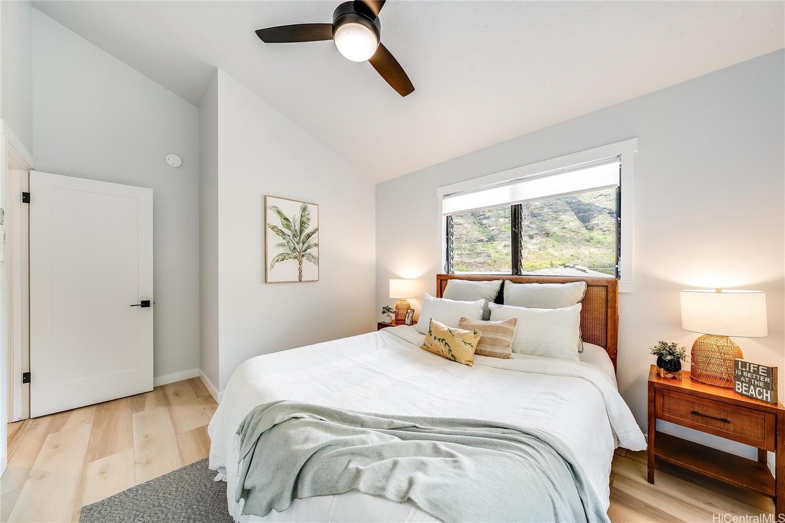 817 Ekoa Place Honolulu, HI 96821 - Photo 16 of 25 a bedroom with a bed and window