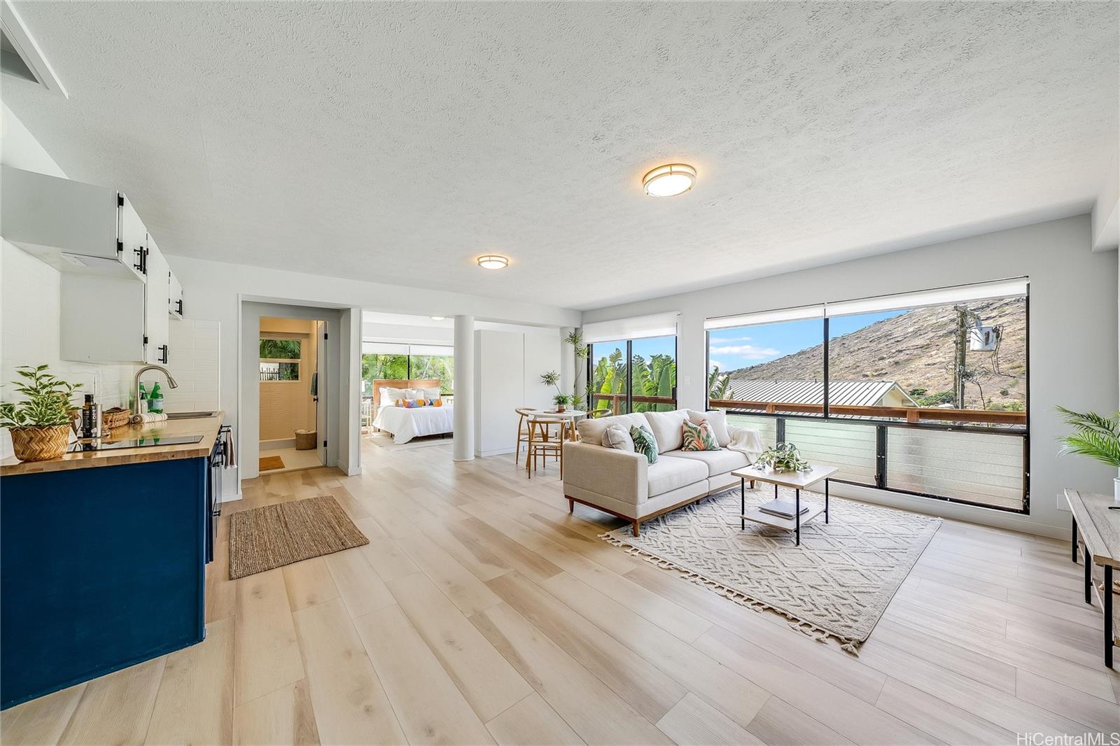 817 Ekoa Place Honolulu, HI 96821 - Photo 19 of 25 a living room with furniture and a table