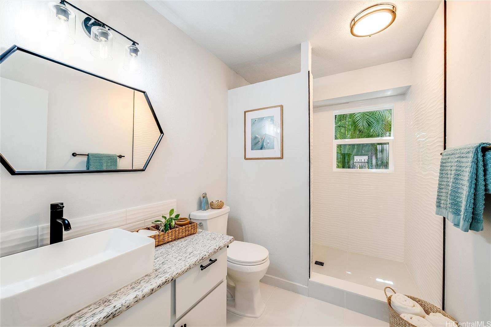 817 Ekoa Place Honolulu, HI 96821 - Photo 21 of 25 a bathroom with a granite countertop sink mirror vanity and toilet