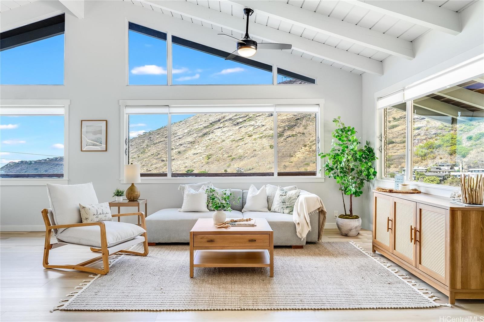 817 Ekoa Place Honolulu, HI 96821 - Photo 3 of 25 a bedroom with furniture and a large window