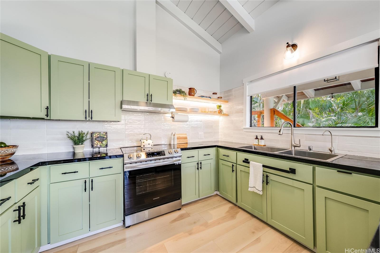 817 Ekoa Place Honolulu, HI 96821 - Photo 8 of 25 a kitchen with sink cabinets and window