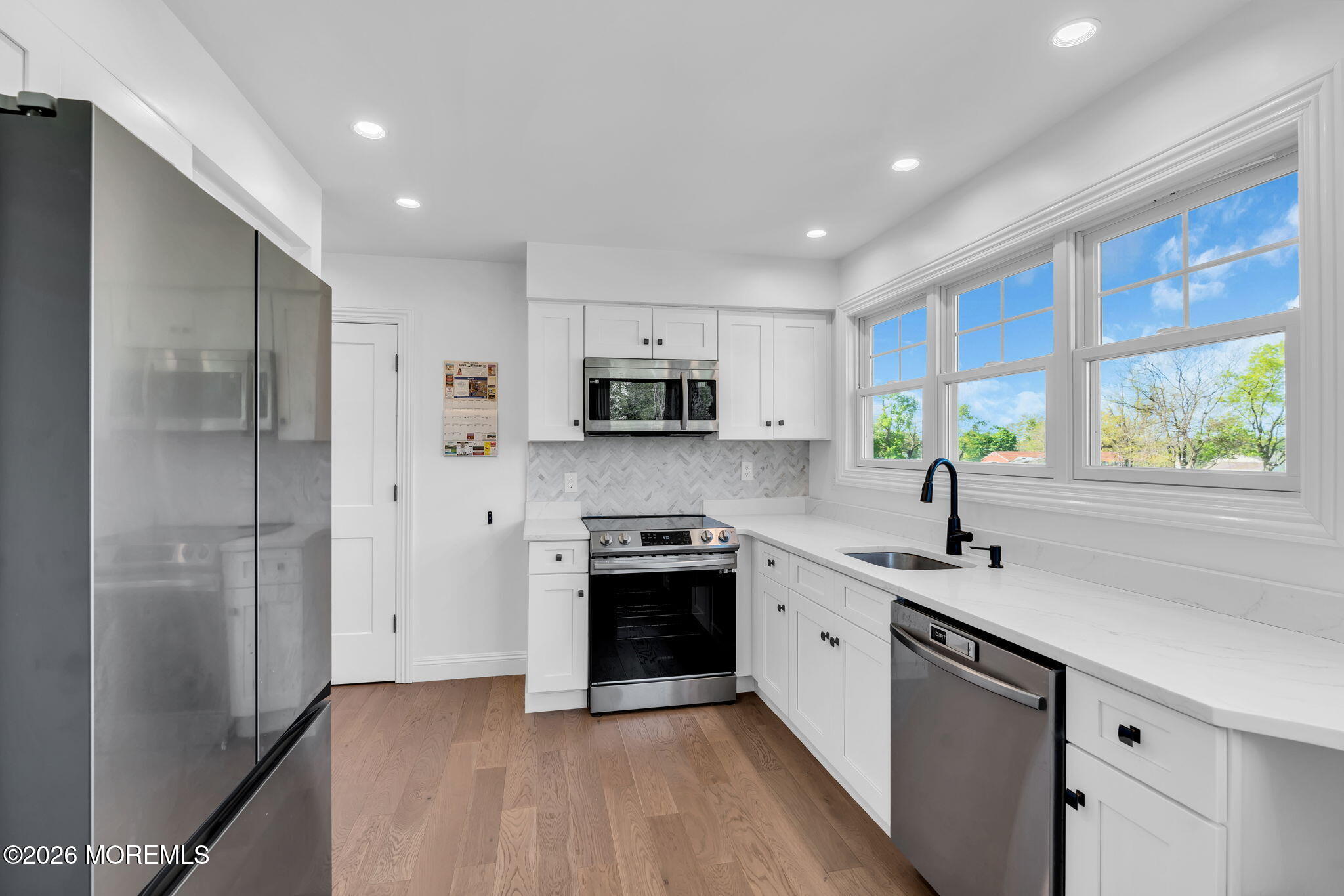 393 County Road 537 Colts Neck, NJ 07722 - Photo 11 of 41 a kitchen with stainless steel appliances granite countertop a sink stove and refrigerator