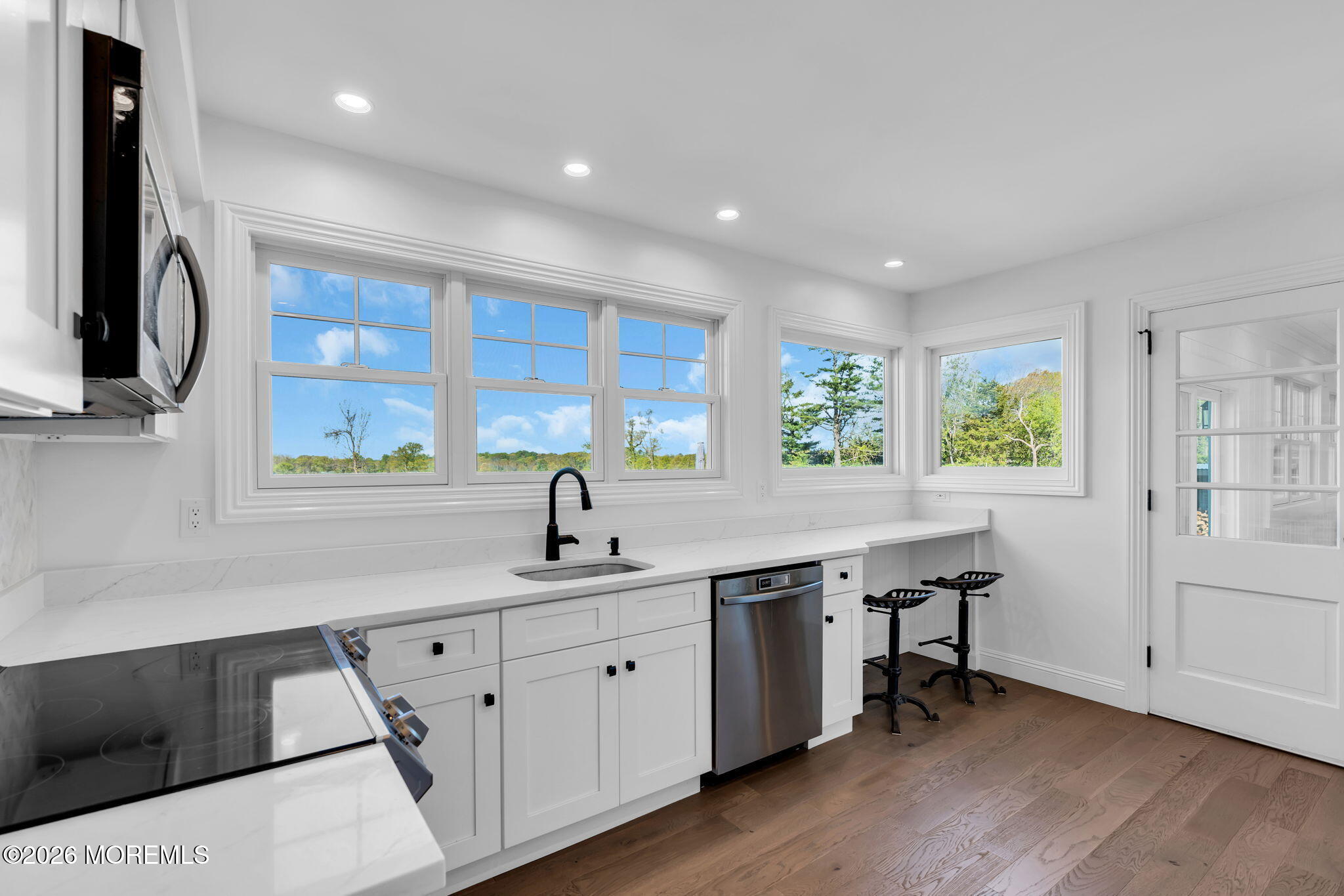 393 County Road 537 Colts Neck, NJ 07722 - Photo 12 of 41 a kitchen with a sink and wooden floor