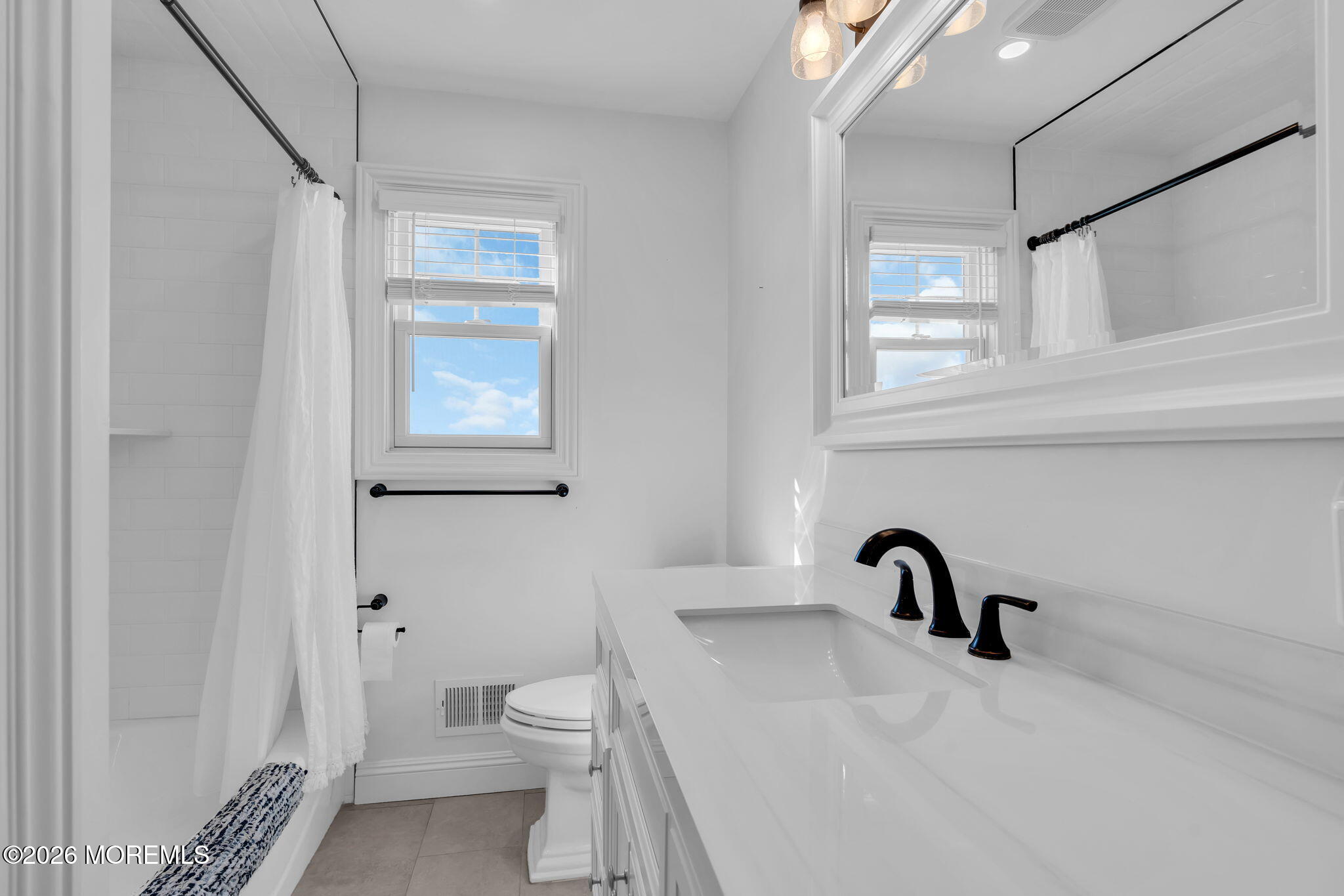 393 County Road 537 Colts Neck, NJ 07722 - Photo 15 of 41 a bathroom with a sink a toilet and a bathtub