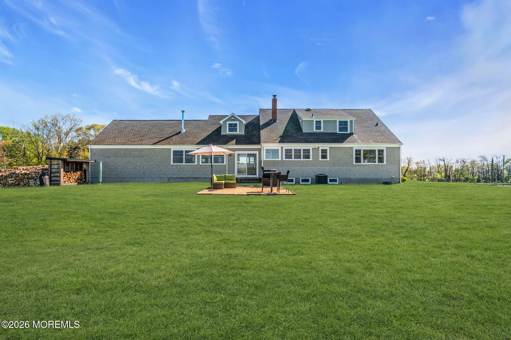 393 County Road 537 Colts Neck, NJ 07722 - Photo 19 of 41 a front view of a house with garden