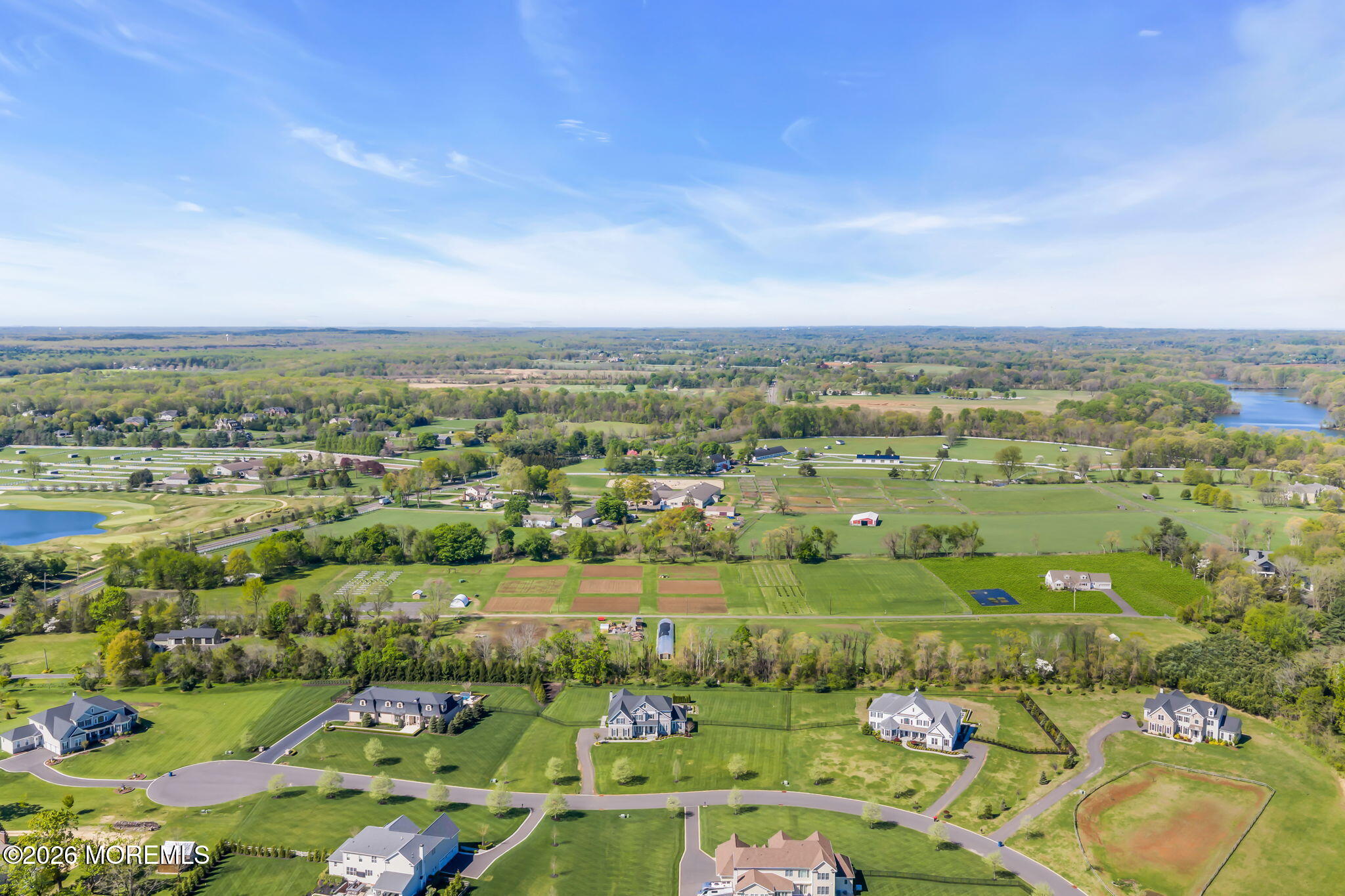 393 County Road 537 Colts Neck, NJ 07722 - Photo 38 of 41 an aerial view of a city with lots of residential buildings and mountain view in back