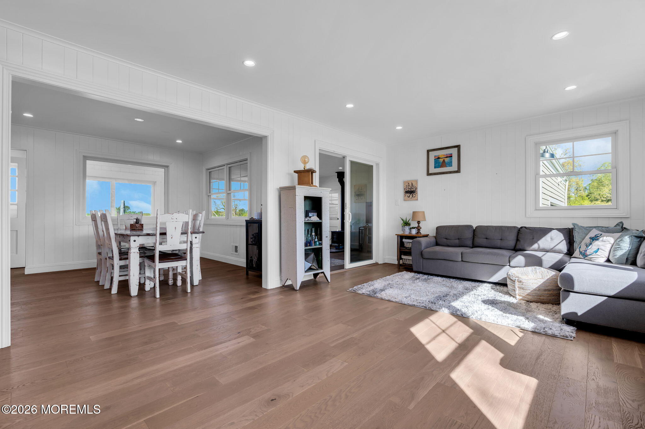 393 County Road 537 Colts Neck, NJ 07722 - Photo 5 of 41 a living room with furniture and a dining table with wooden floor