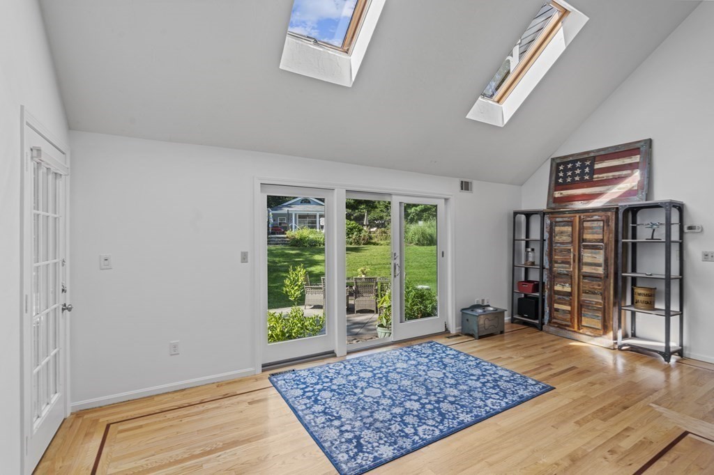 104 Burnt Swamp Road Cumberland, RI 02864 - Photo 13 of 32 a living room with a rug