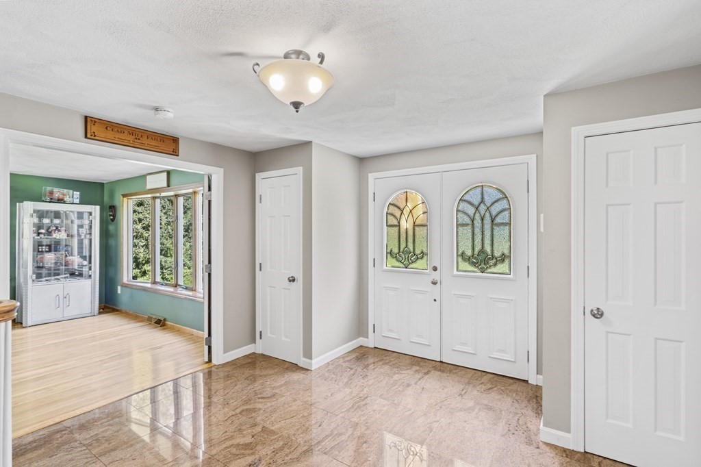 104 Burnt Swamp Road Cumberland, RI 02864 - Photo 2 of 32 an empty room with window and ceiling fan