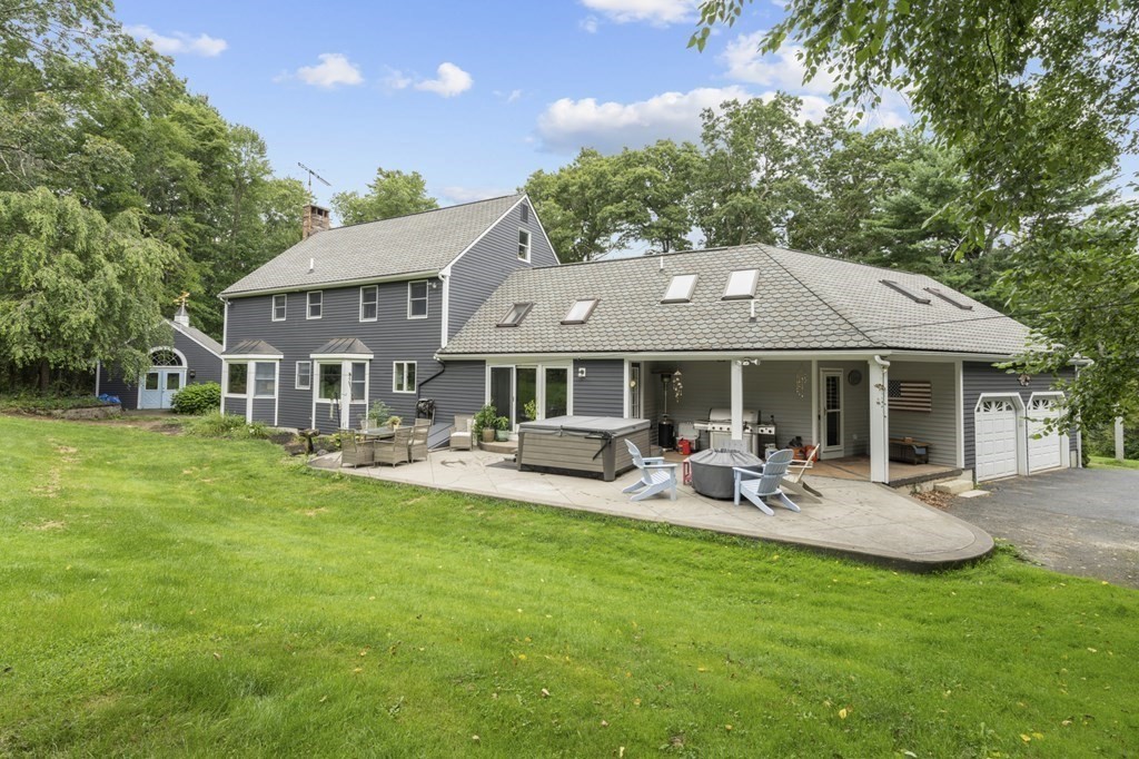 104 Burnt Swamp Road Cumberland, RI 02864 - Photo 23 of 32 a front view of house with yard and outdoor seating