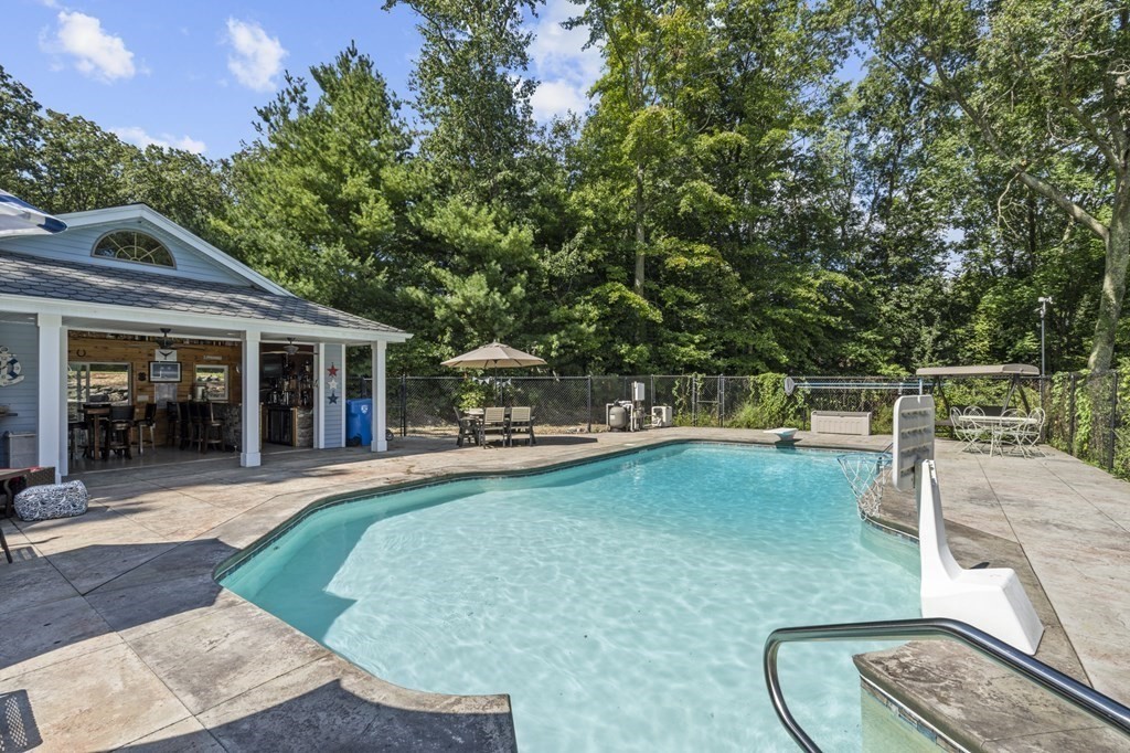 104 Burnt Swamp Road Cumberland, RI 02864 - Photo 24 of 32 a view of a house with swimming pool and sitting area