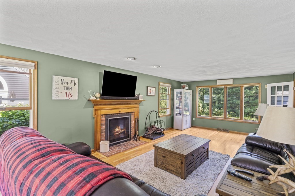 104 Burnt Swamp Road Cumberland, RI 02864 - Photo 6 of 32 a living room with furniture fireplace and flat screen tv