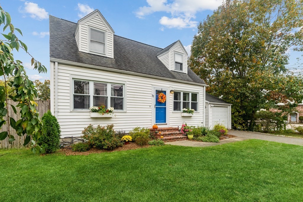 22 Sumner Street Dedham, MA 02026 - Photo 1 of 39 a front view of a house with a garden