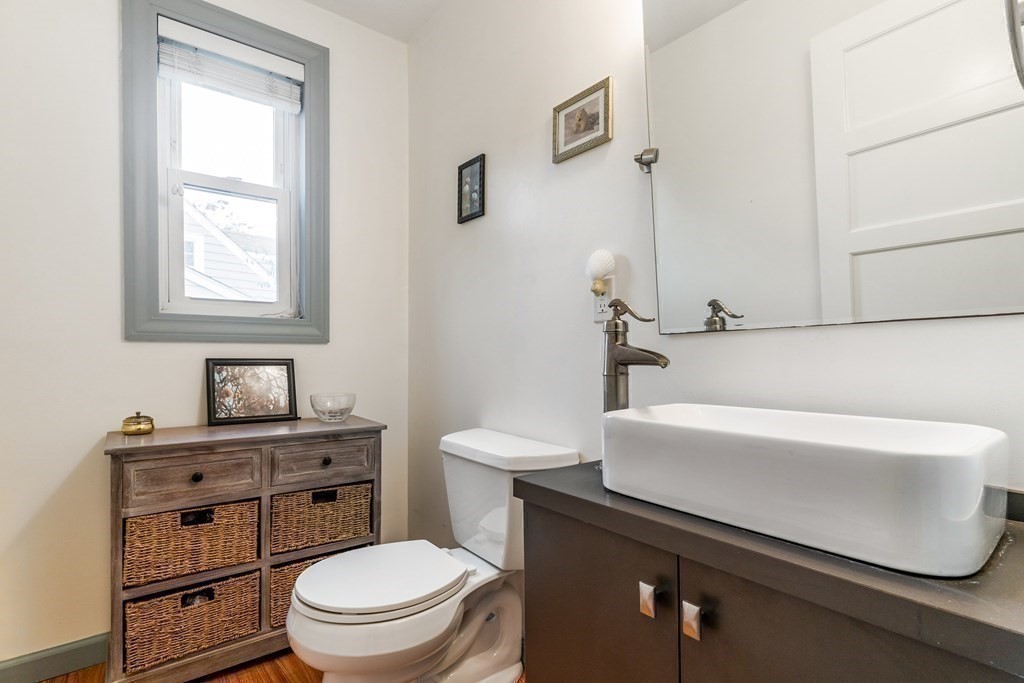 22 Sumner Street Dedham, MA 02026 - Photo 16 of 39 a white toilet sitting next to a bathroom sink
