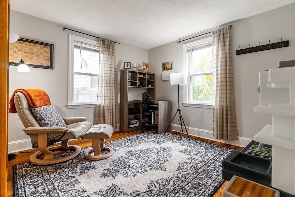22 Sumner Street Dedham, MA 02026 - Photo 18 of 39 a living room with furniture and a window
