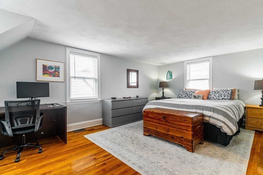 22 Sumner Street Dedham, MA 02026 - Photo 25 of 39 a bedroom with a bed and a desk