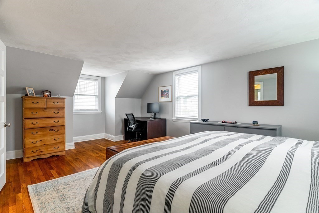 22 Sumner Street Dedham, MA 02026 - Photo 28 of 39 a bed room with a bed and a television