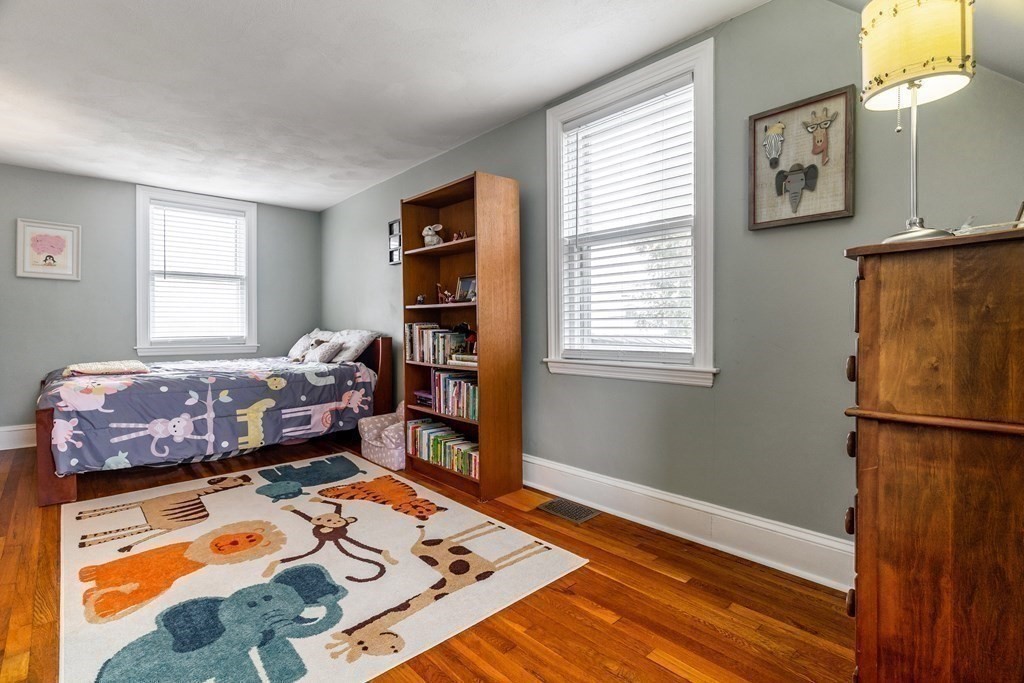 22 Sumner Street Dedham, MA 02026 - Photo 30 of 39 a bedroom with a bed and a window