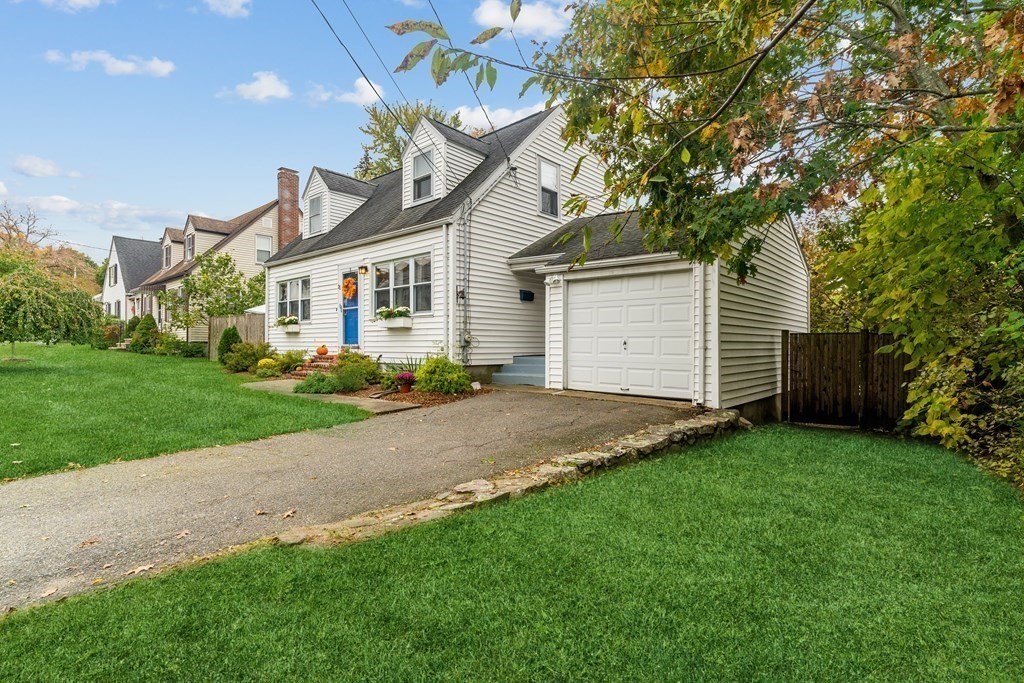 22 Sumner Street Dedham, MA 02026 - Photo 3 of 39 a front view of house with yard and green space