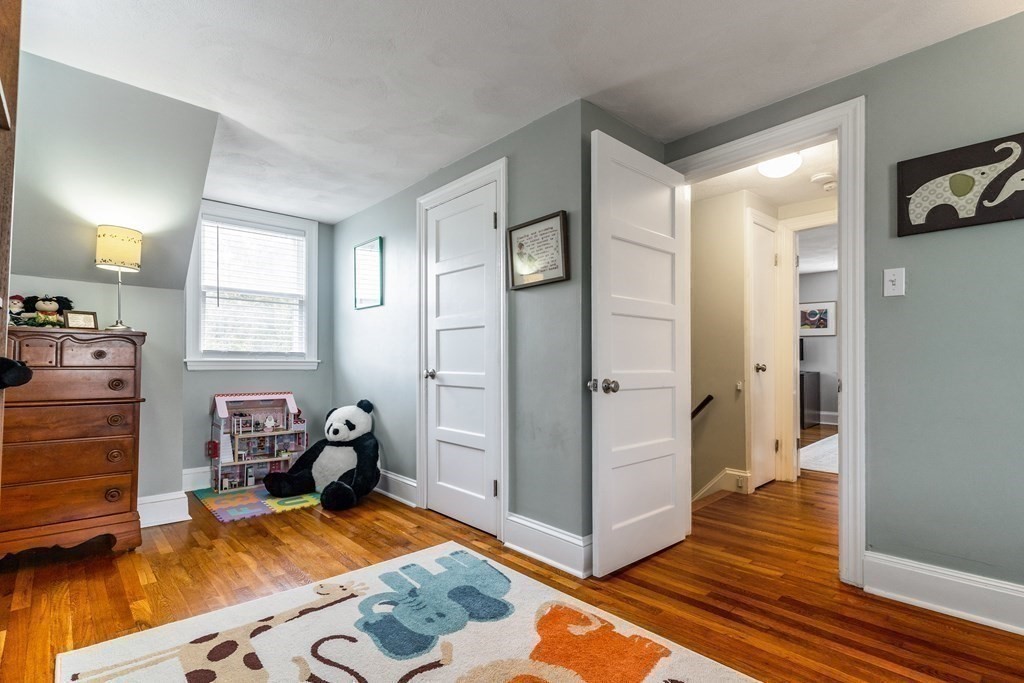 22 Sumner Street Dedham, MA 02026 - Photo 32 of 39 a room with a bed and furniture