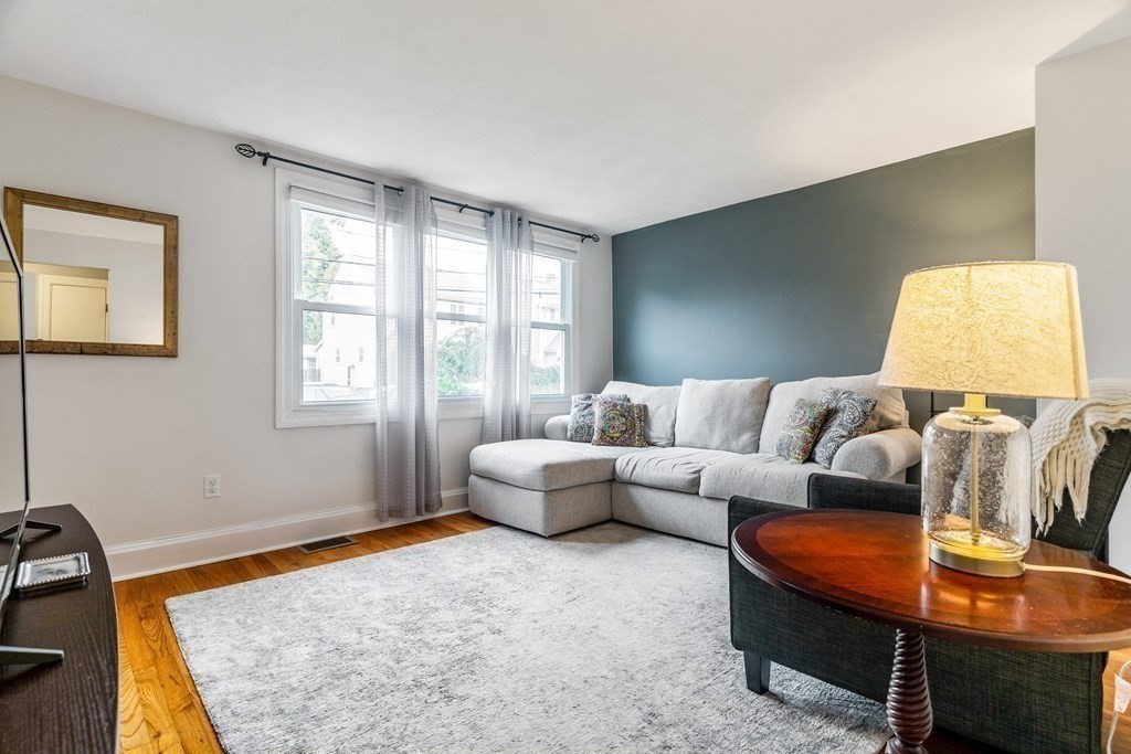 22 Sumner Street Dedham, MA 02026 - Photo 5 of 39 a living room with furniture and a couch