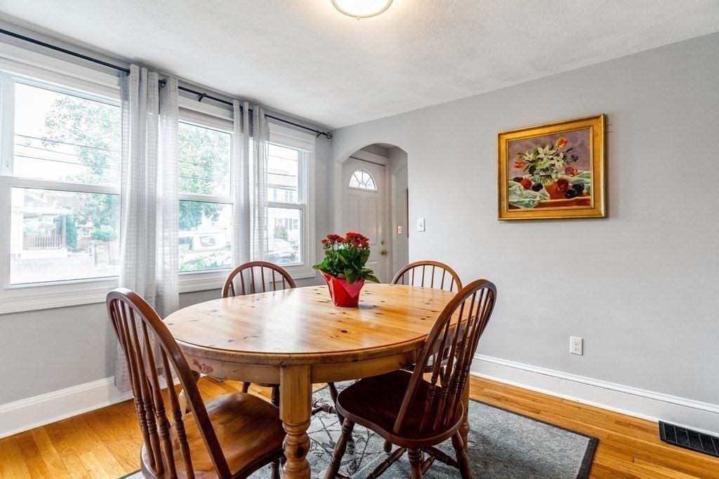 22 Sumner Street Dedham, MA 02026 - Photo 10 of 39 a dining room with furniture and wooden floor