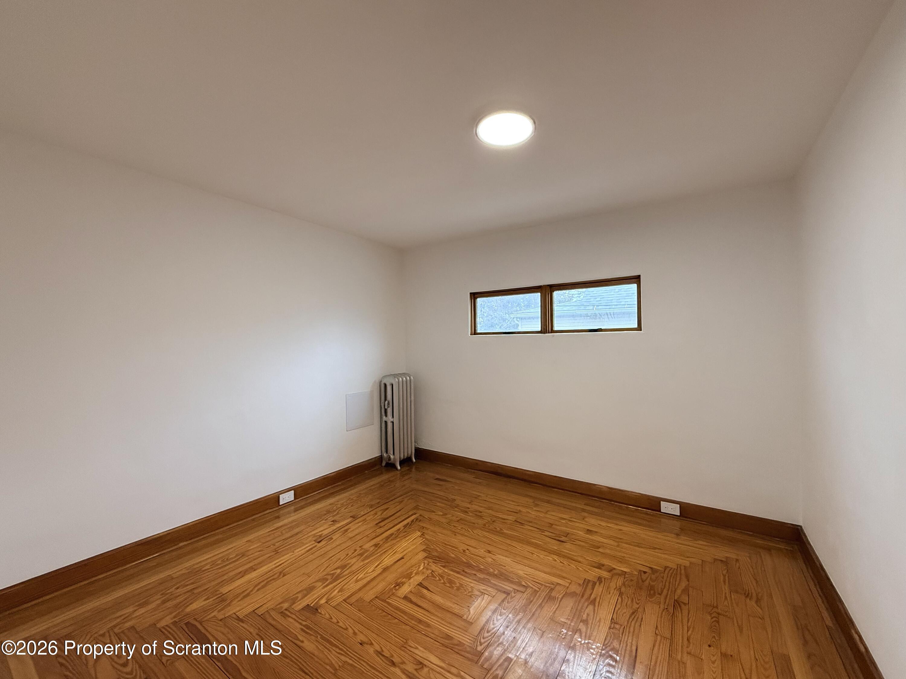 1717 Clay Avenue, Unit 2 Scranton, PA 18509 - Photo 3 of 5 a view of a room with wooden floor and window