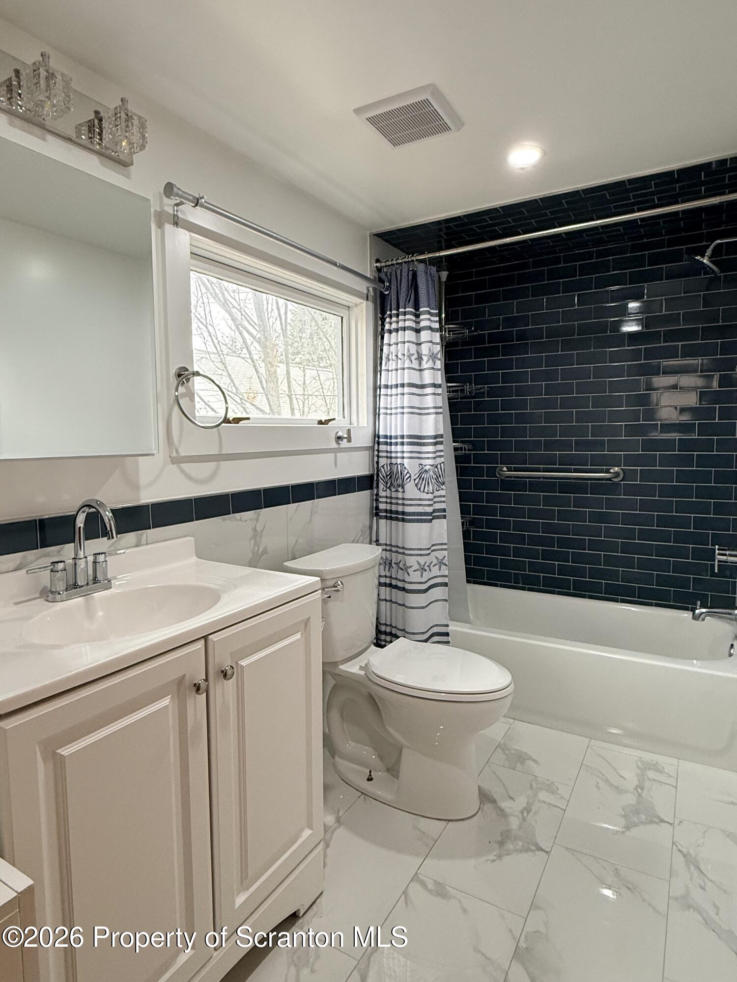 1717 Clay Avenue, Unit 2 Scranton, PA 18509 - Photo 5 of 5 a bathroom with a sink toilet and shower