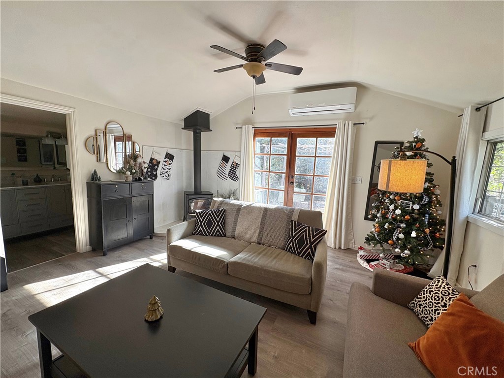 36750 Hilltop Road Yucaipa, CA 92399 - Photo 15 of 27 a living room with furniture and a chandelier