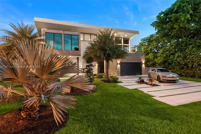 a view of backyard of house with outdoor seating and green space