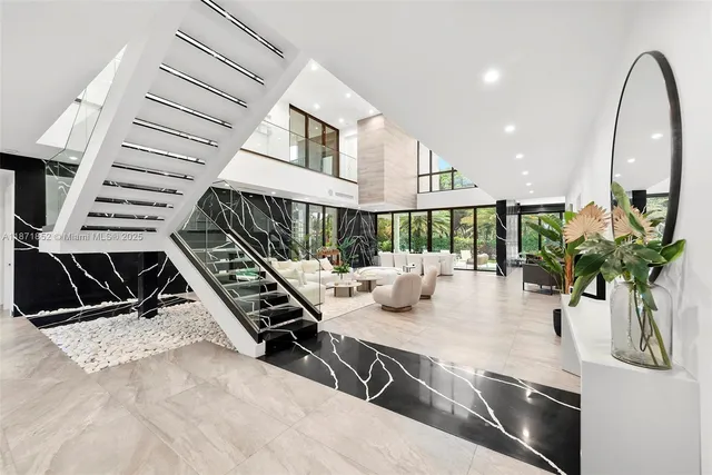a view of an entryway with wooden floor