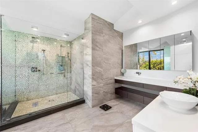 a bathroom with a bathtub shower sink and toilet