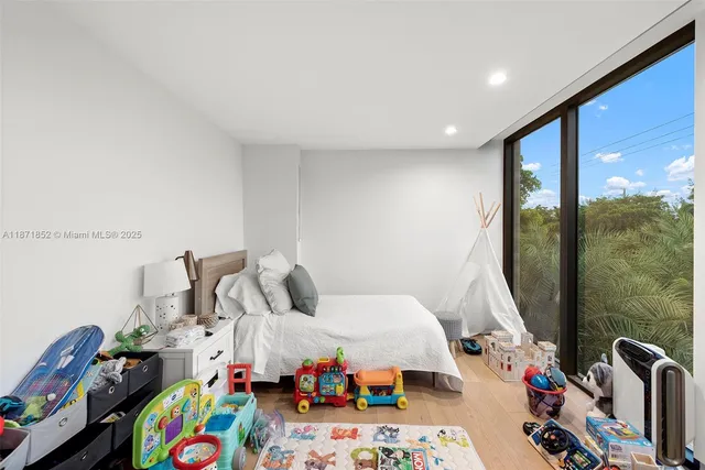 a bed room with a bed and a window