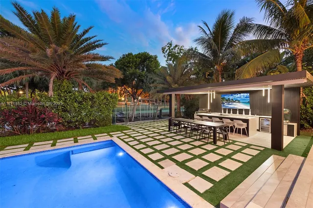 a view of a chairs and table in th patio