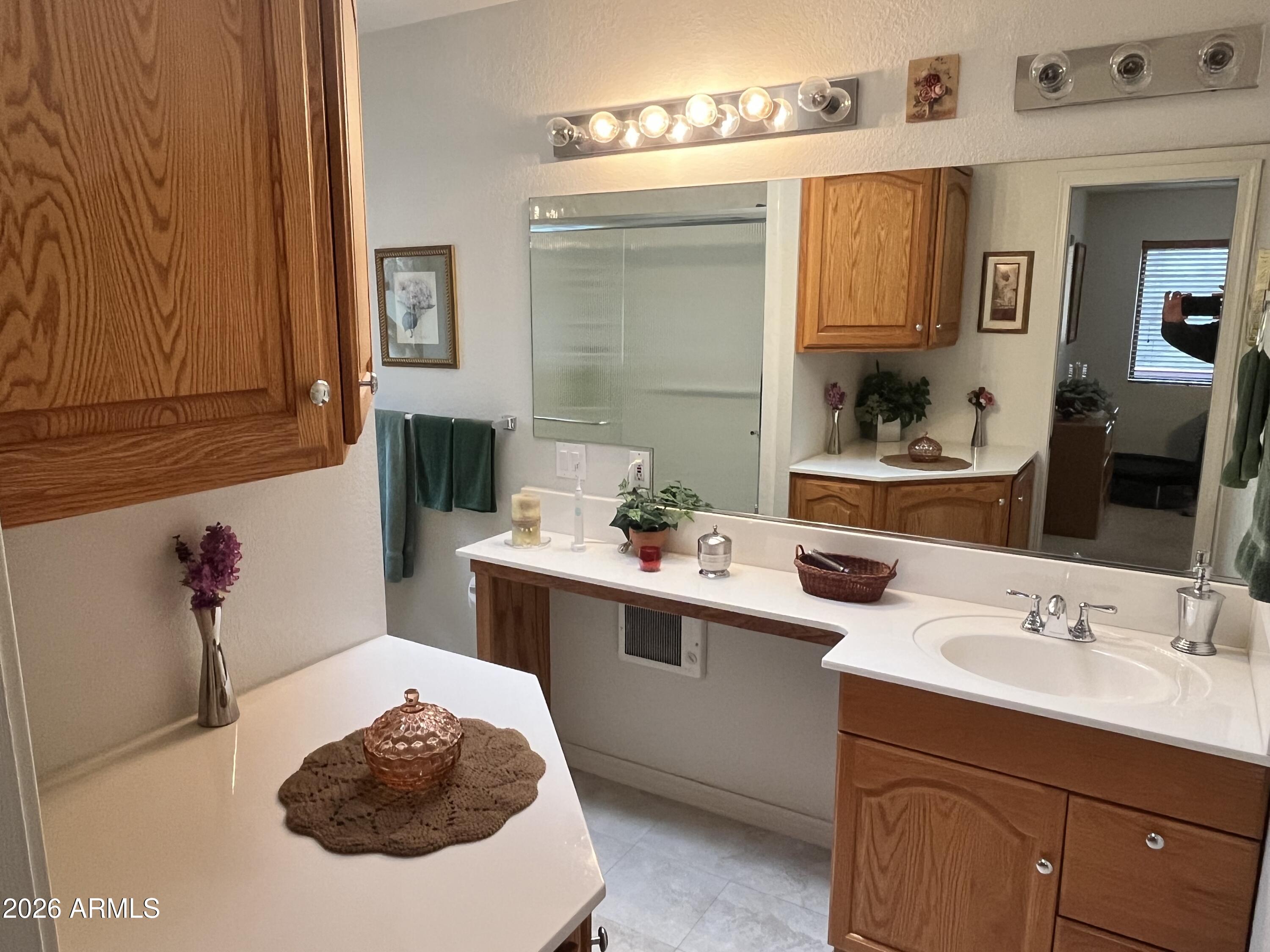 1006 North Matterhorn Road Payson, AZ 85541 - Photo 17 of 37 a bathroom with a sink and a mirror