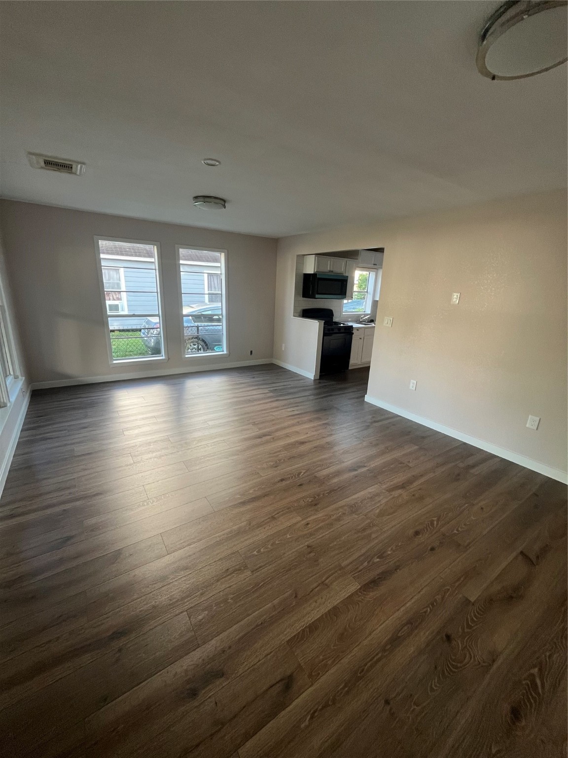 222 East Adoue Avenue Baytown, TX 77520 - Photo 2 of 8 Another view of living room offers a plenty of room for and gatherings.
