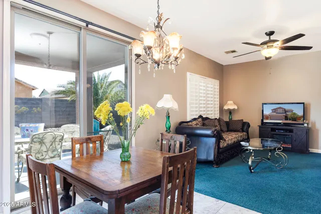a view of a dining room with furniture window and outside view