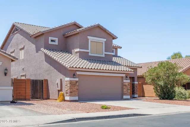 a front view of a house with a garage