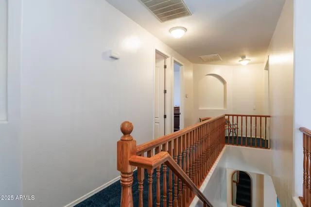 a view of entryway with stairs and wooden floor