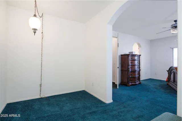 a view of an empty room with a fireplace