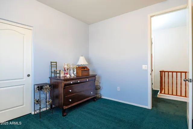 a room with a dresser and a wooden floor